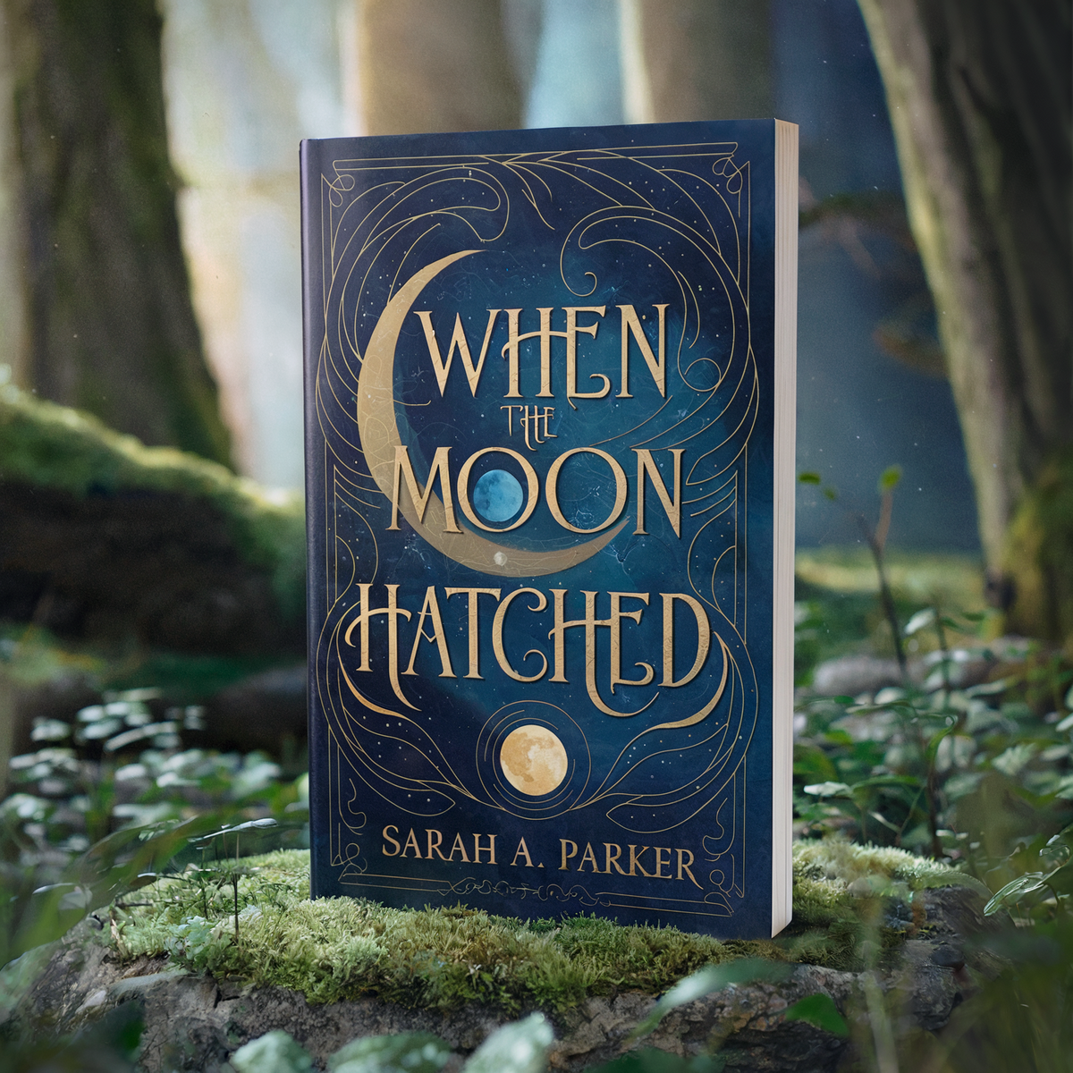 A fantasy book titled "When the Moon Hatched" by Sarah A. Parker, displayed in a forest setting.